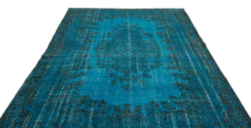 Load image 1 in gallery view. Teal and black distressed rug with a traditional central medallion and ornate border pattern on a white background.