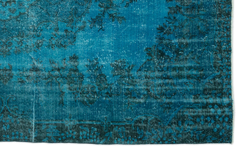 Load image 1 in gallery view. Teal and black distressed rug with a faded traditional floral pattern on a white background.
