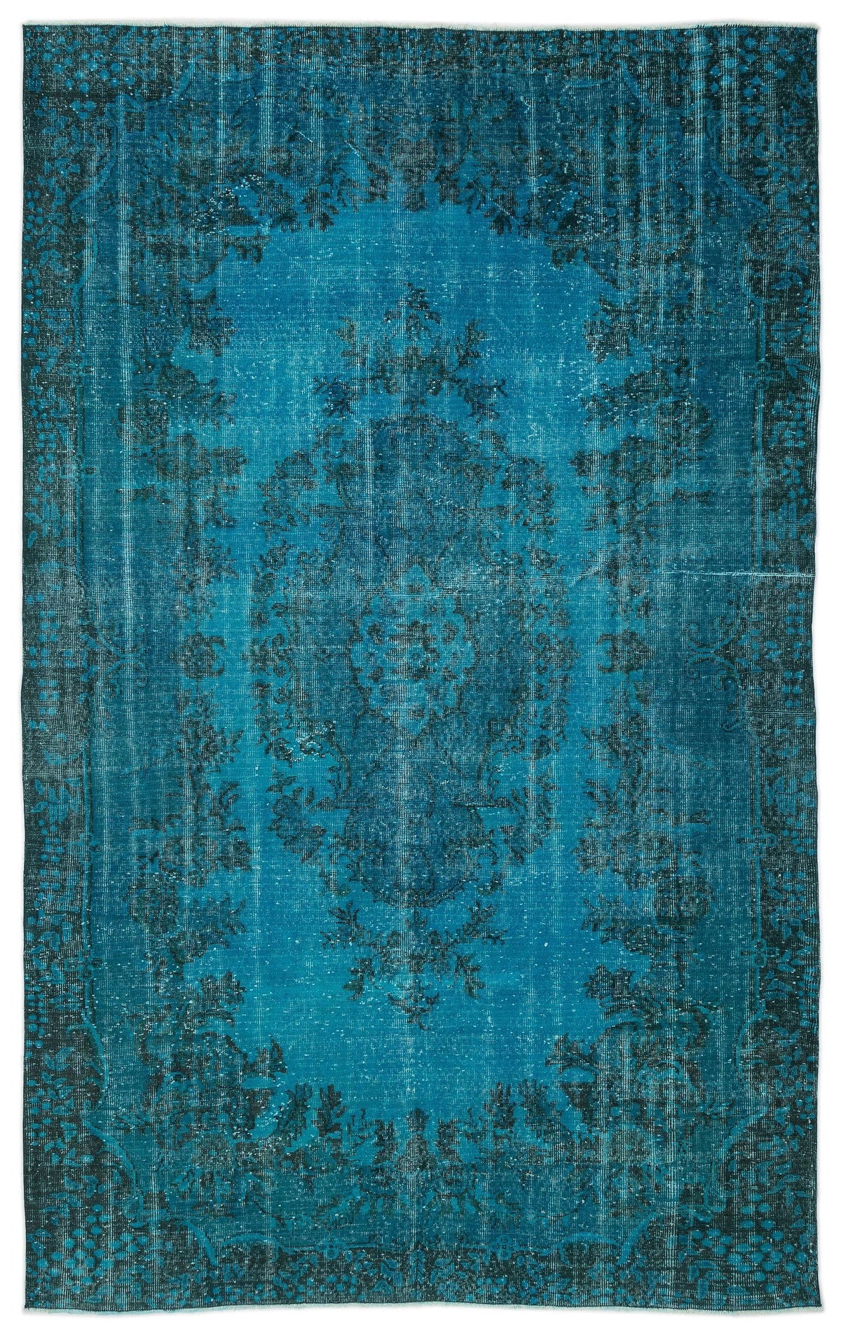 Teal and black distressed vintage-style rug with a central floral medallion and ornate border.