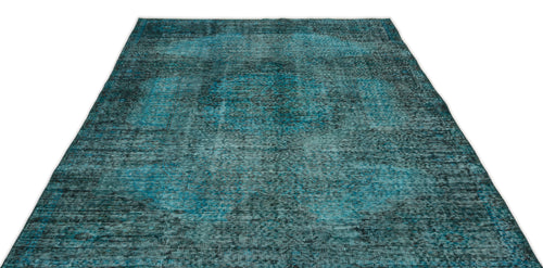 Load image 1 in gallery view. Teal and black distressed vintage-style rug with a faded central medallion pattern on a white background.