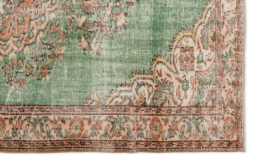 Load image 1 in gallery view. Distressed sage green and terracotta rug with a traditional floral medallion pattern and a detailed border.