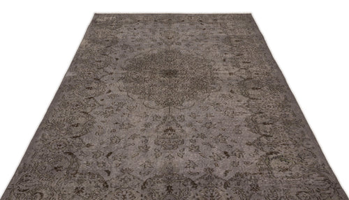 Load image 1 in gallery view. Charcoal grey distressed rug with a traditional central medallion and ornate floral motifs on a white background.