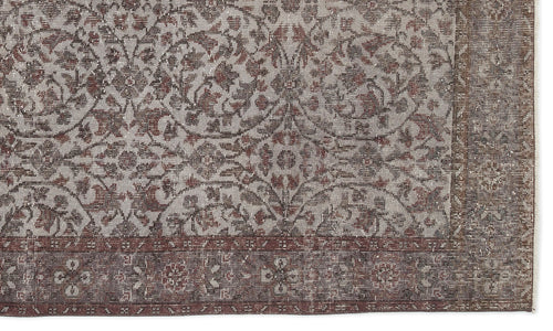 Load image 1 in gallery view. Distressed grey and rust-red rug with a traditional floral medallion pattern and a wide, ornate border.
