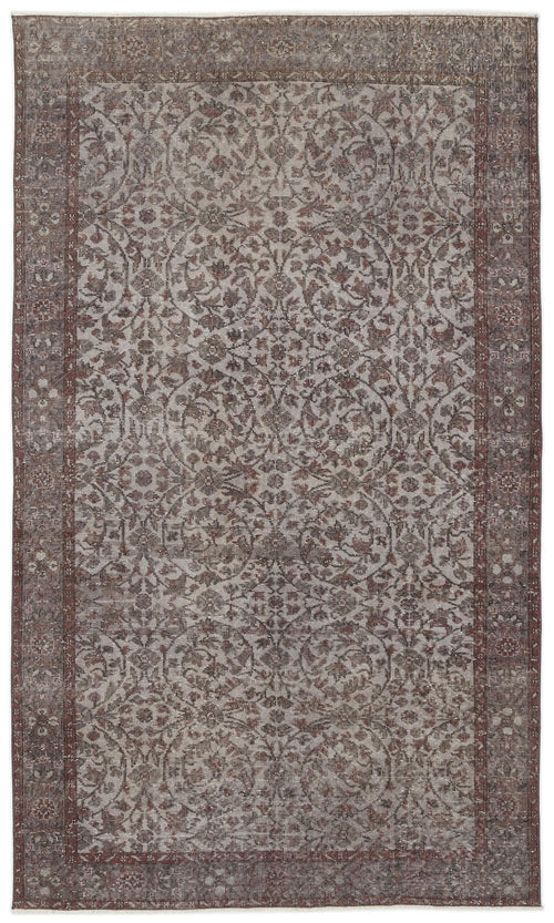 Load image 1 in gallery view. Brown and grey distressed rug with a traditional floral medallion pattern and a wide decorative border.