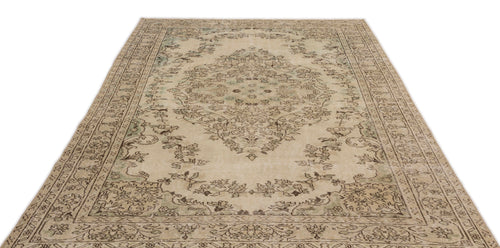 Load image 1 in gallery view. The Mamail Vintage Medallion Rug (6'4" x 9'7") is a rectangular beige rug with an intricate light brown and green floral medallion design and a decorative border on a white background.