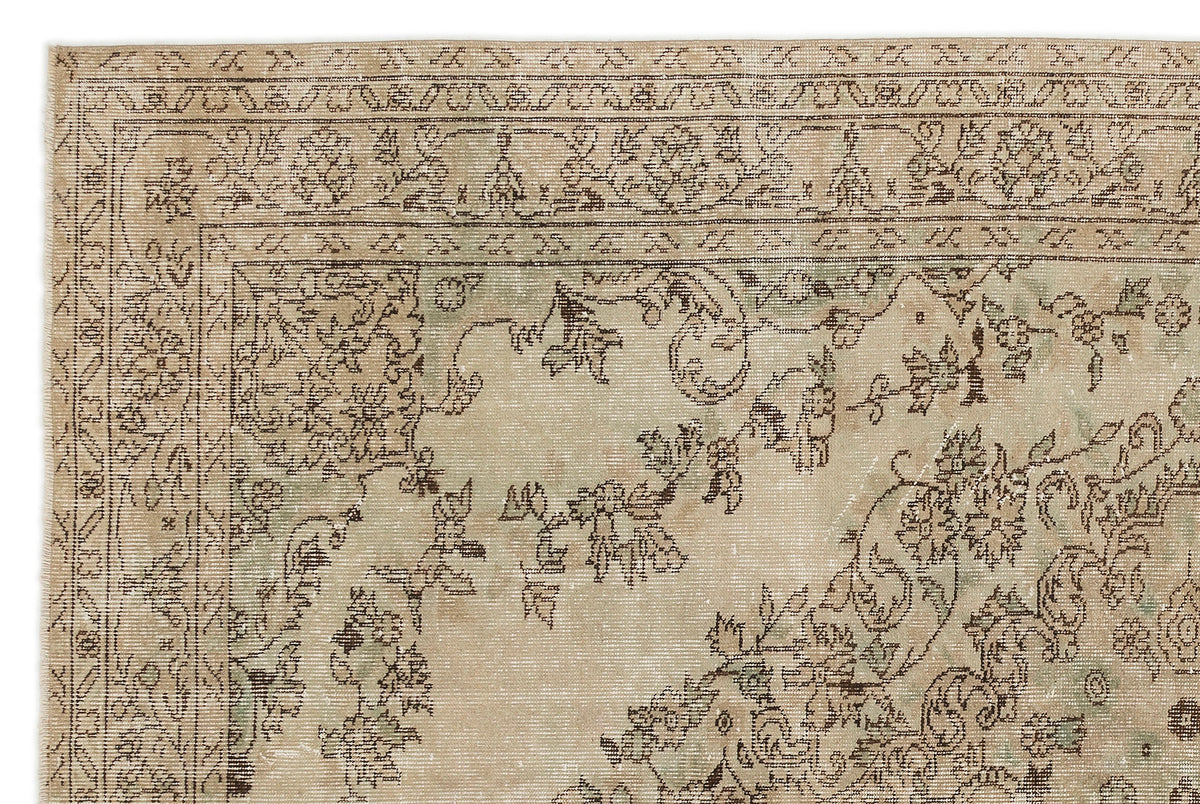 A close-up of the Mamail - Vintage Medallion Rug (6'4 X 9'7) shows its ornate floral medallion pattern in muted beige, brown, and green shades with a detailed decorative border.