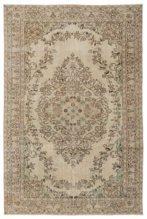 Load image 1 in gallery view. The Mamail Vintage Medallion Rug (6'4 x 9'7) features a rectangular shape, intricate floral medallion design in beige, taupe, and muted green tones, with an ornate border and worn finish that evoke Anatolian heritage and vintage charm.