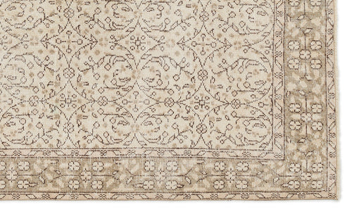 Load image 1 in gallery view. The Mofean - Vintage Floral Rug (5'2 x 8'7) features a beige and tan Anatolian hand-woven design with intricate floral and vine patterns, a detailed geometric-floral border, and a slightly distressed vintage look.