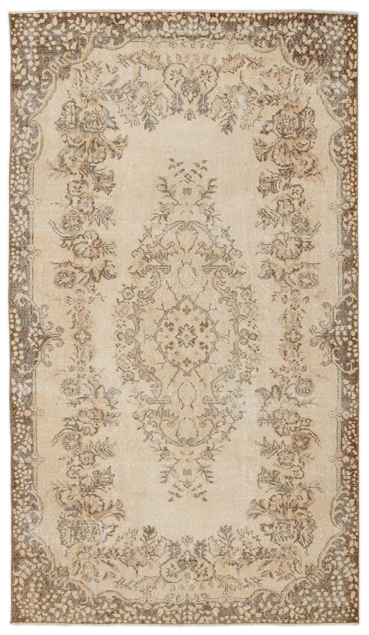 Beige and brown vintage-style rug with a central floral medallion and a distressed, ornate border.