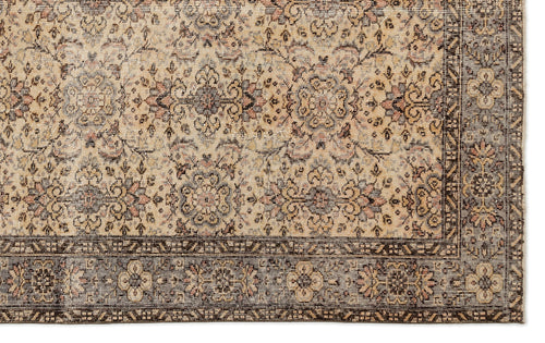 Load image 1 in gallery view. Beige and brown traditional rug with a distressed floral medallion pattern and a dark border.