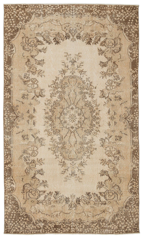 Load image 1 in gallery view. Beige and brown vintage-style rug with a central floral medallion and a decorative border on a white background.
