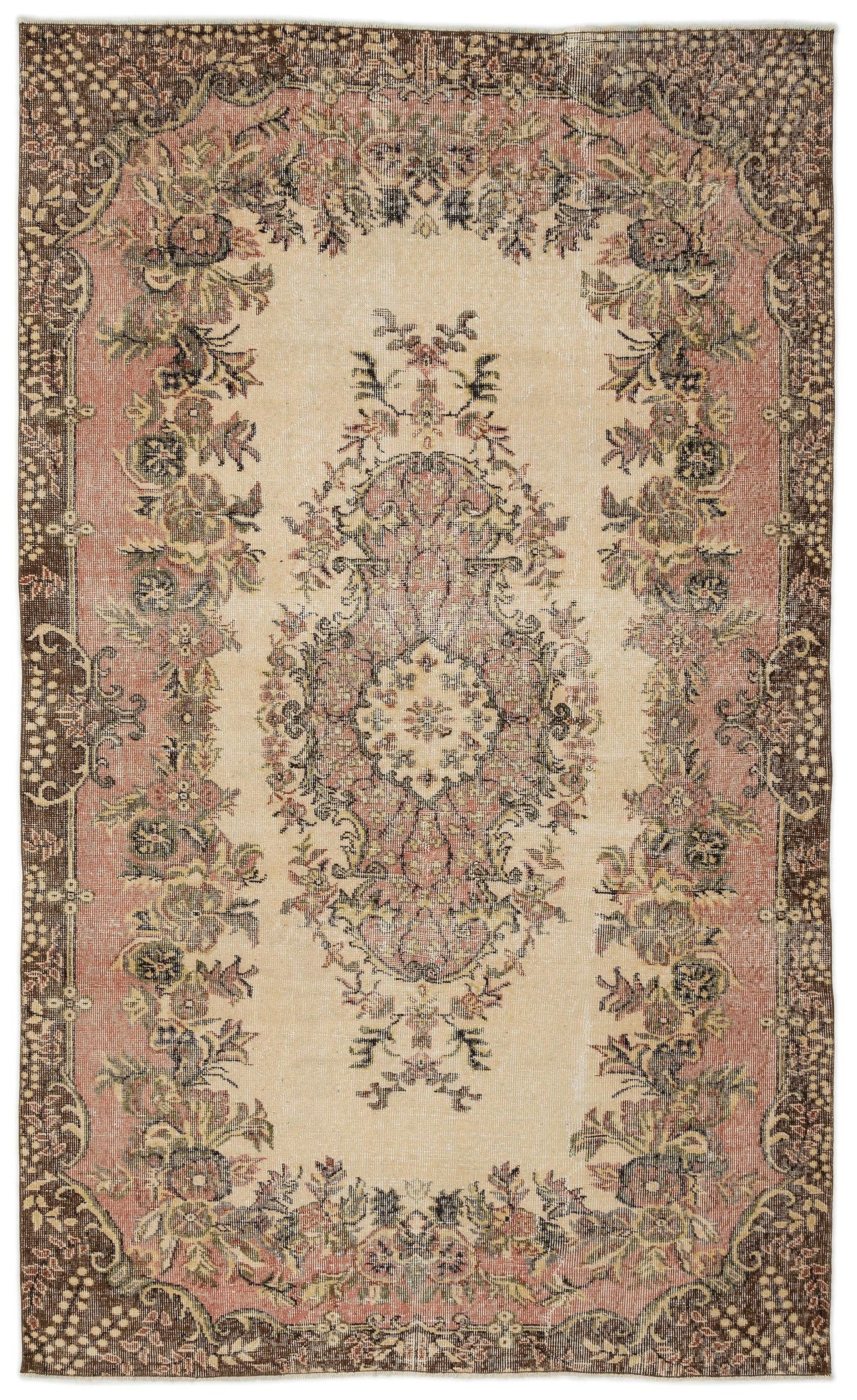 Distressed beige, pink, and brown vintage-style rug with a central floral medallion and ornate border.