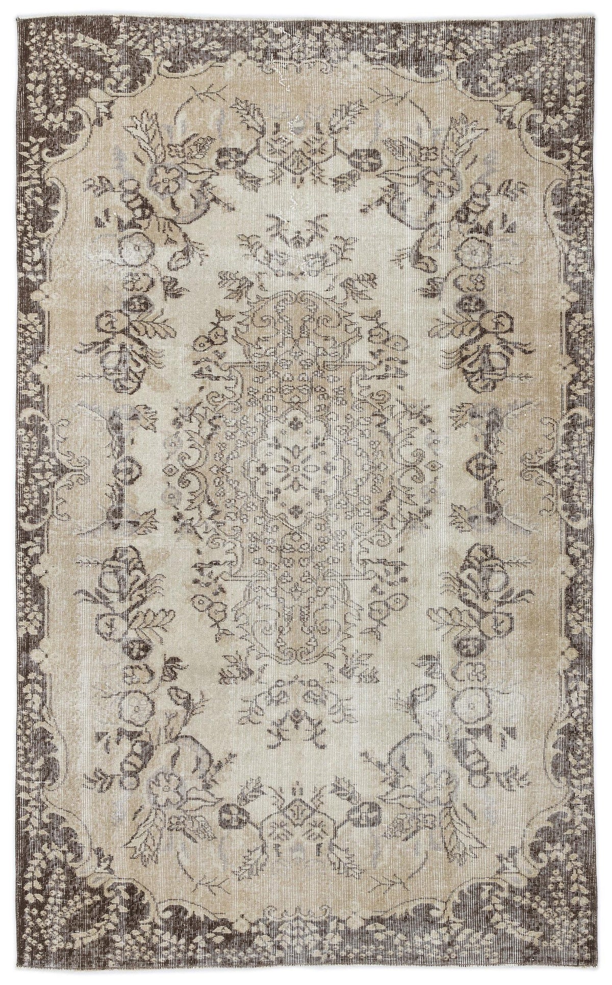 Beige and dark brown distressed rug with a traditional floral medallion pattern and ornate border.