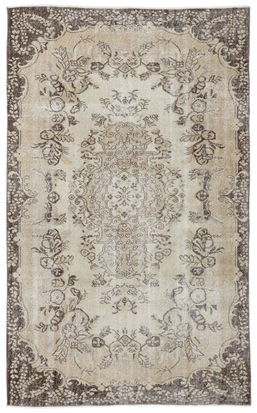 Load image 1 in gallery view. Beige and dark brown distressed rug with a traditional floral medallion pattern and ornate border.
