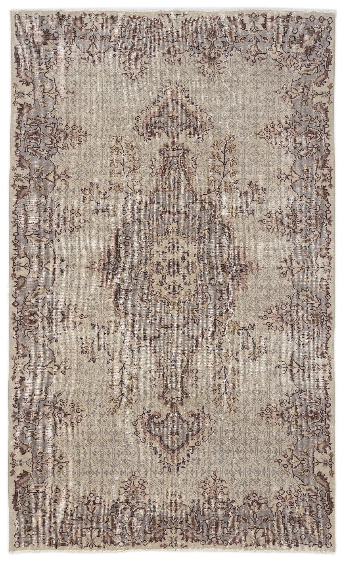 Beige and grey vintage-style rug with a central floral medallion and intricate border pattern on a white background.