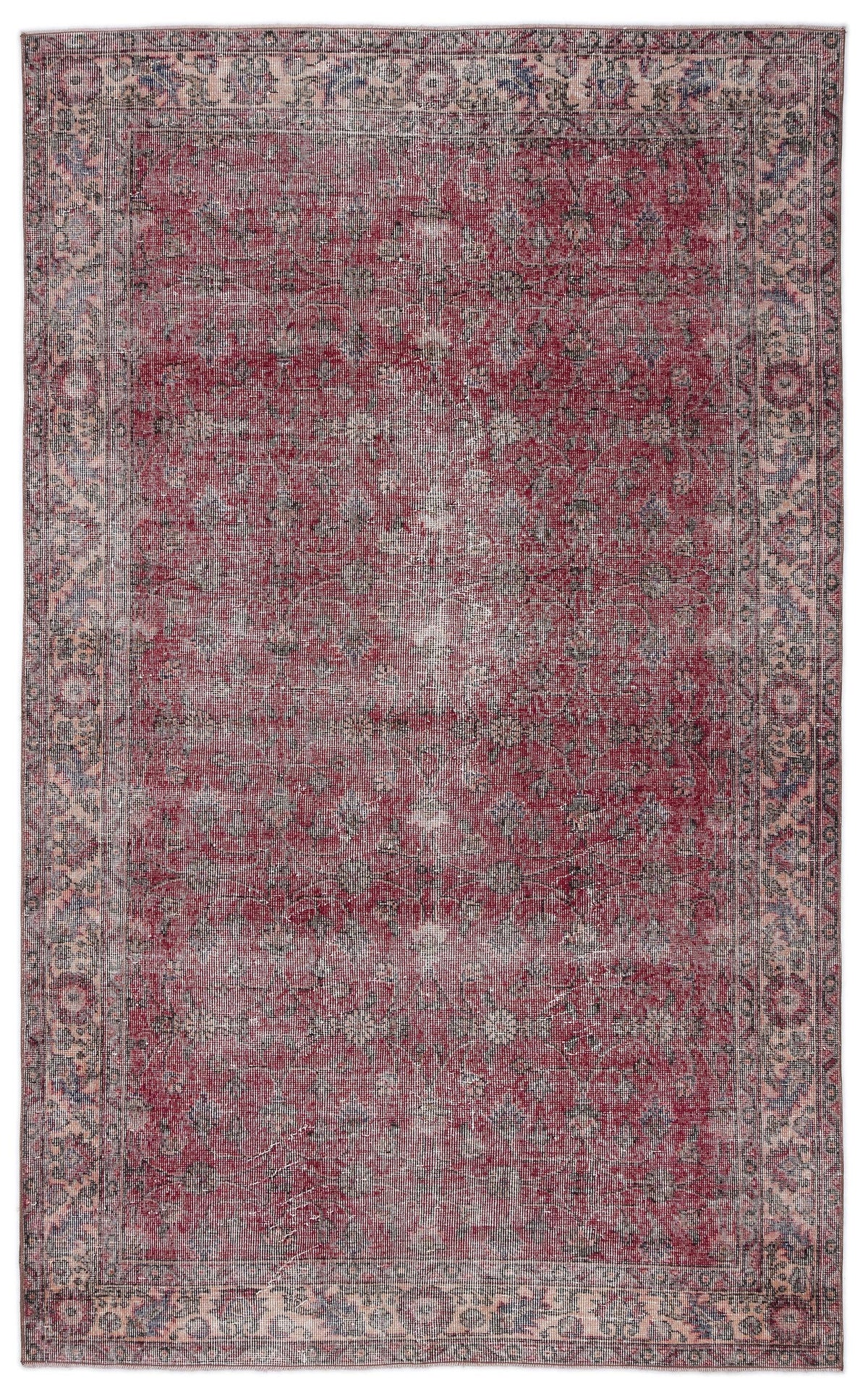 Distressed red and navy blue traditional rug with a faded floral medallion pattern on a white background.