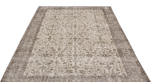 Load image 1 in gallery view. Taupe and cream distressed rug with a traditional floral medallion pattern and a wide decorative border.