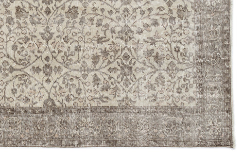 Load image 1 in gallery view. Beige and brown rug with a distressed traditional floral medallion pattern and a wide decorative border.