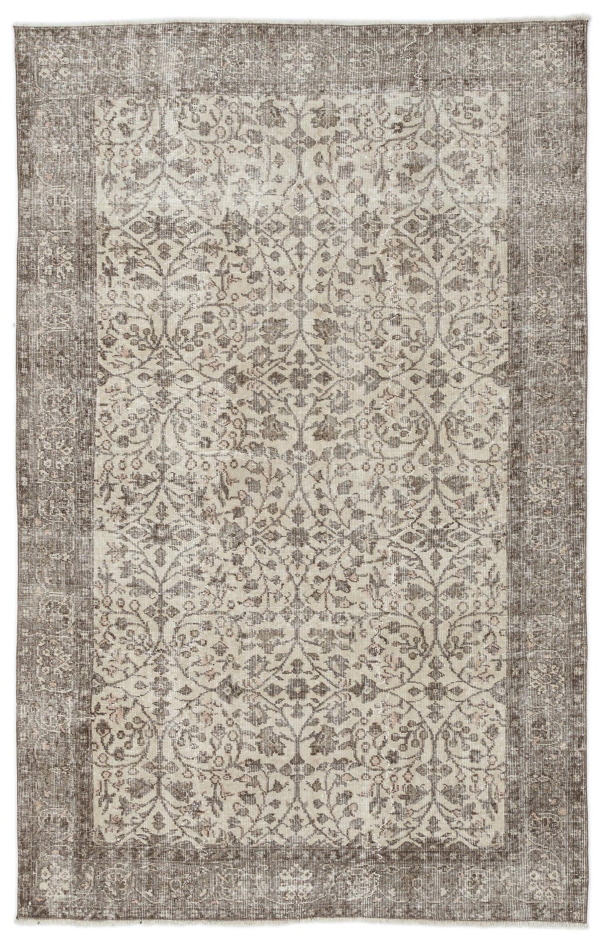 Taupe and cream distressed rug with a traditional floral medallion pattern and a wide decorative border.