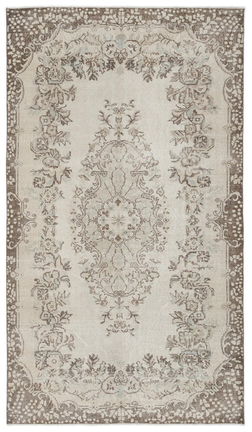 Load image 1 in gallery view. Beige and brown vintage-style rug with a central floral medallion and ornate border on a white background.