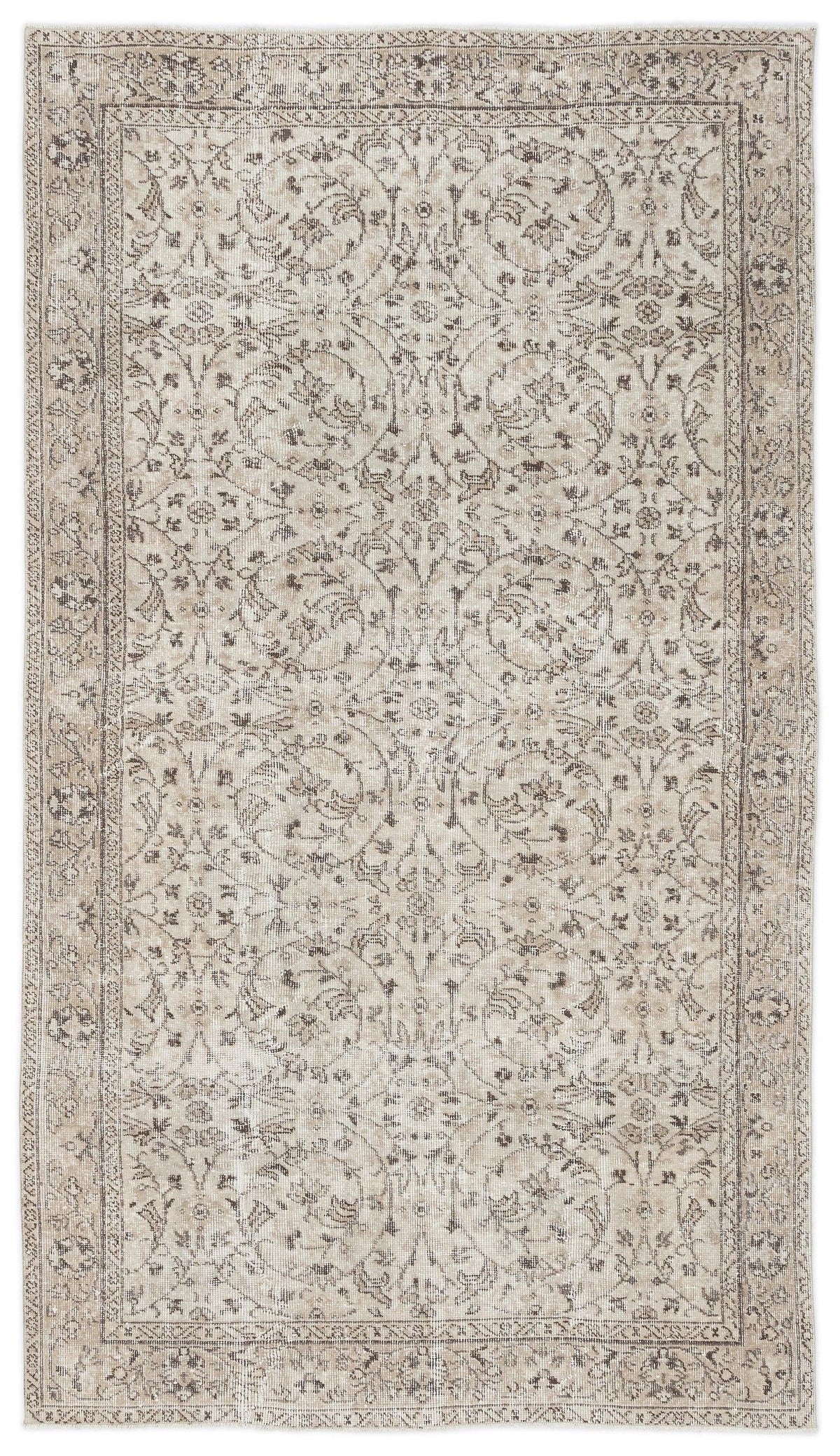 Beige and taupe vintage-style rug with a distressed floral medallion pattern and a detailed border.