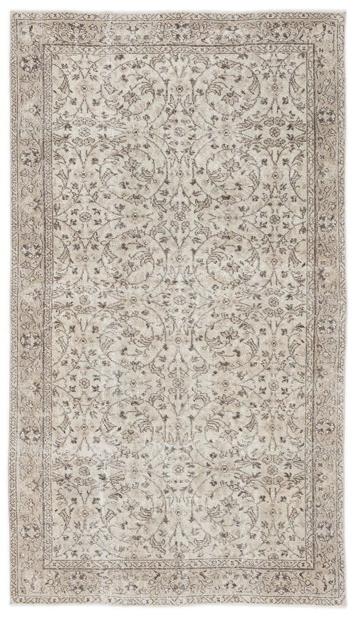 Load image 1 in gallery view. Beige and taupe vintage-style rug with a distressed floral medallion pattern and a detailed border.