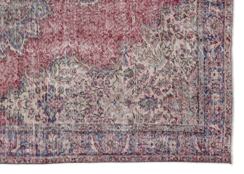 Load image 1 in gallery view. Distressed red, blue, and cream traditional rug with an intricate floral medallion pattern and a bordered edge.