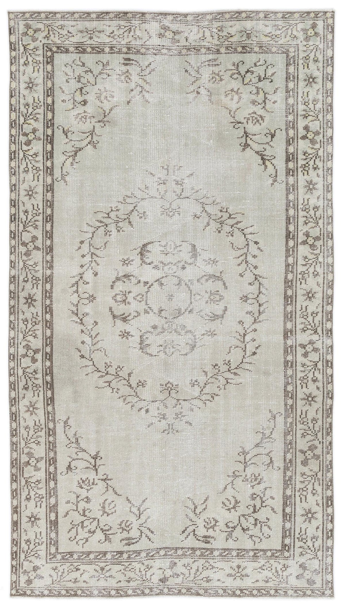 Light gray and taupe vintage-style rug with a central floral medallion and a decorative botanical border.