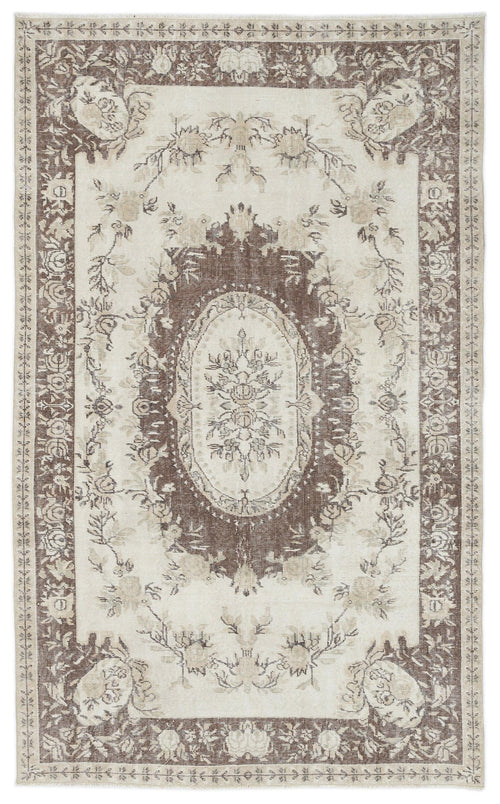 Load image 1 in gallery view. Cream and brown traditional rug with a central floral medallion and ornate botanical border.