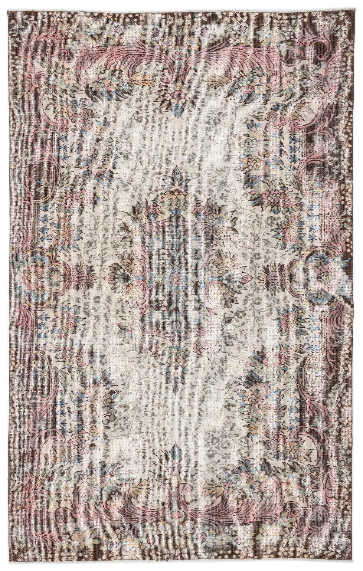 Distressed vintage-style rug with a central floral medallion, ornate borders, and a palette of brown, pink, and blue.
