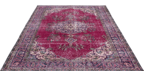 Load image 1 in gallery view. Magenta distressed Persian-style rug with a central medallion and ornate floral border on a white background.