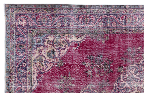 Load image 1 in gallery view. Distressed magenta and navy blue traditional rug with an ornate floral medallion border and faded vintage finish.