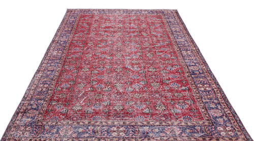 Load image 1 in gallery view. Red and blue traditional Persian-style rug with a distressed floral pattern and a wide decorative border.