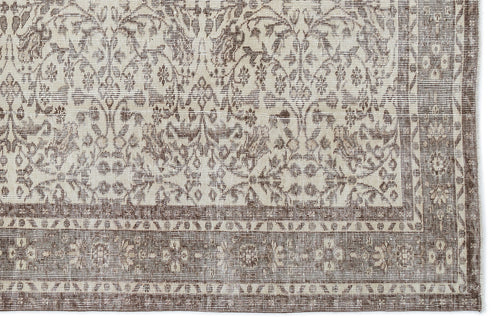 Load image 1 in gallery view. Taupe and cream rug with a distressed traditional floral medallion pattern and a wide decorative border.