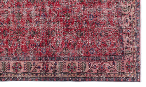 Load image 1 in gallery view. Distressed red and pink traditional rug with a faded floral medallion pattern and a dark border.