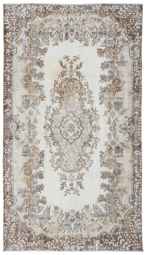 Load image 1 in gallery view. Distressed cream rug with a central floral medallion and dark brown border in a traditional Persian-style pattern.