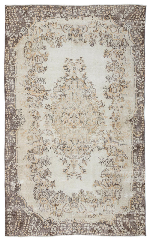 Load image 1 in gallery view. Cream and brown vintage-style rug with a central floral medallion and a distressed, ornate border.