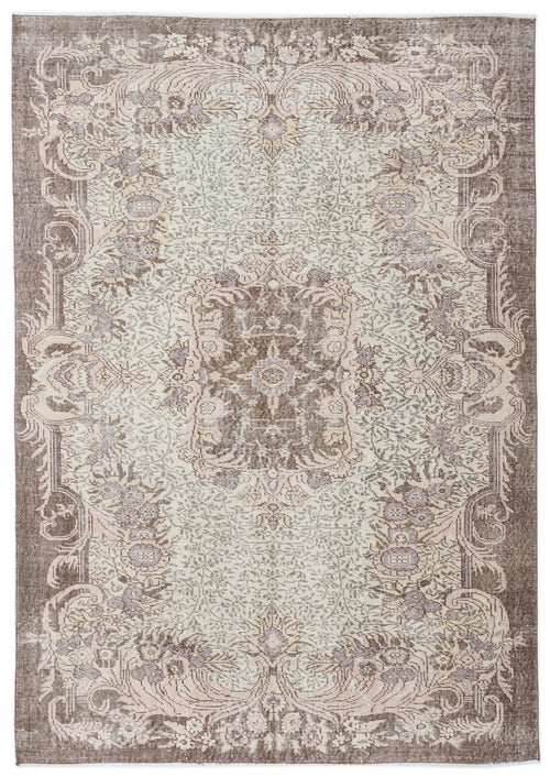 Load image 1 in gallery view. Distressed brown and cream traditional rug with a central floral medallion and ornate border on a white background.