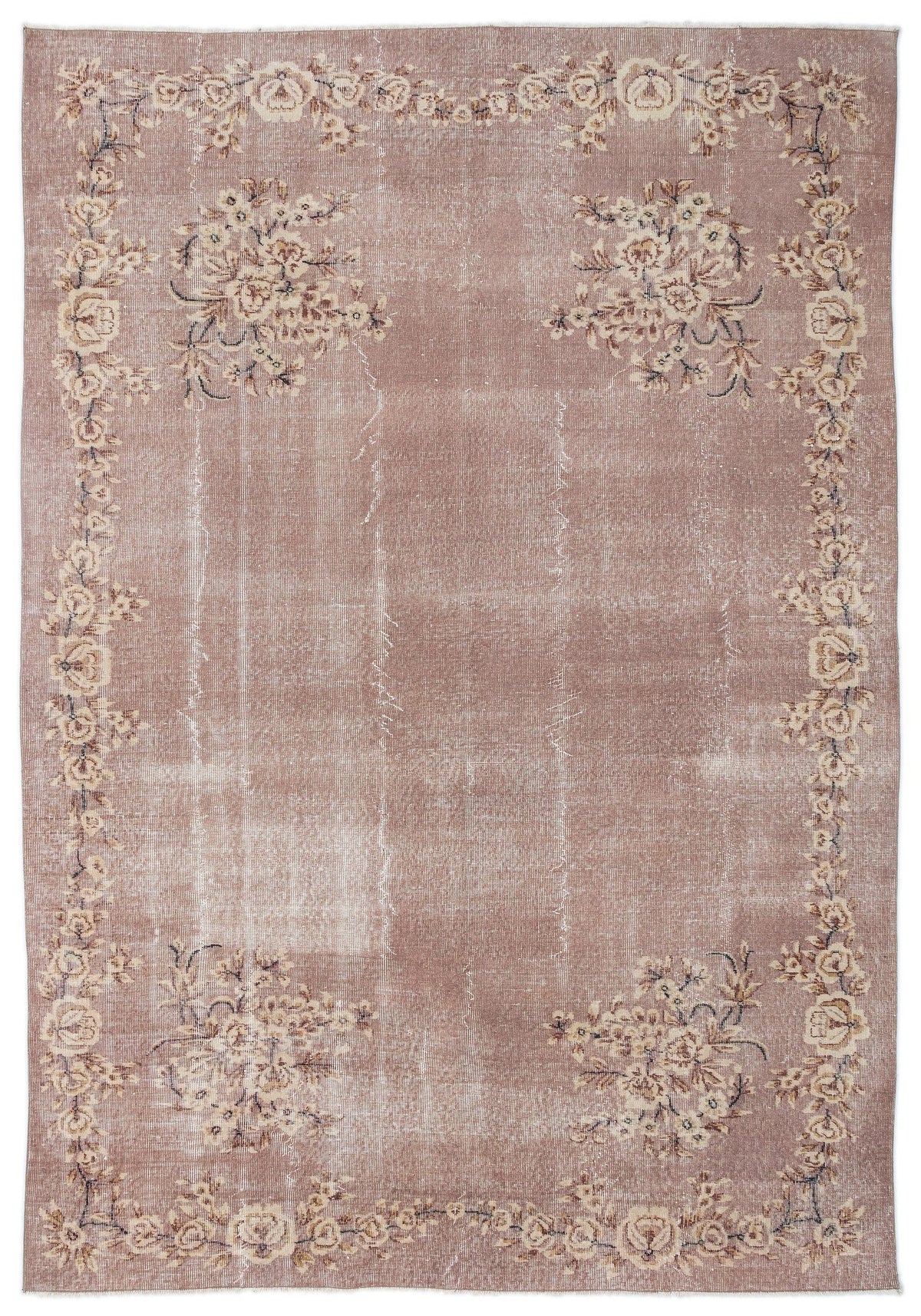 Dusty rose vintage-style rug with a distressed floral border and corner bouquet motifs on a white background.
