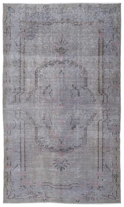 Load image 1 in gallery view. Distressed grey and lavender vintage-style rug with a central medallion and linear border pattern on a white background.