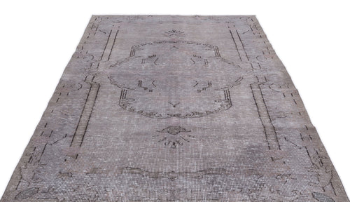 Load image 1 in gallery view. Grey distressed vintage-style rug with a faded central medallion and linear border pattern on a white background.