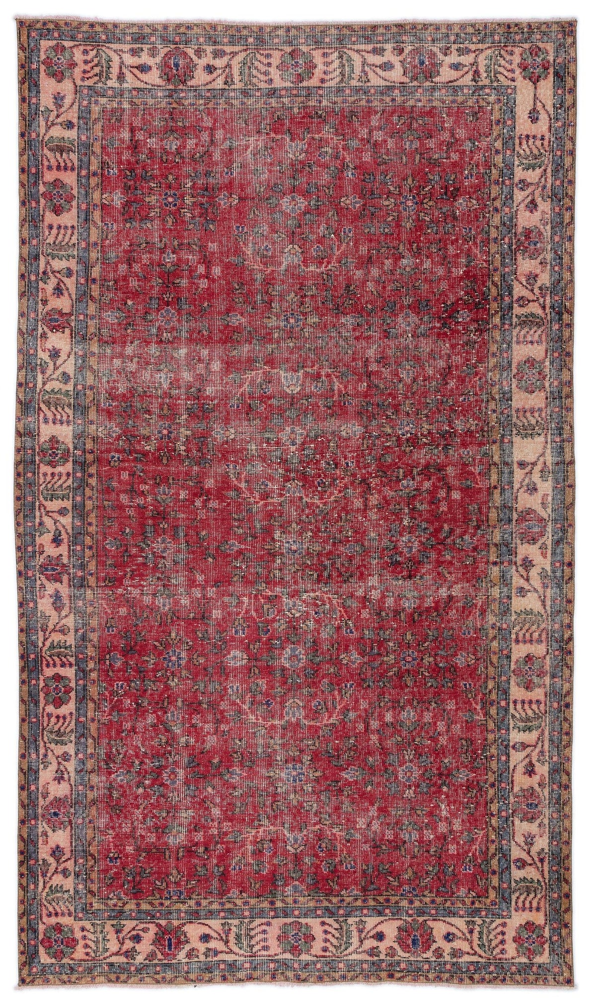 Red traditional rug with a distressed floral medallion pattern and a beige border featuring intricate botanical motifs.