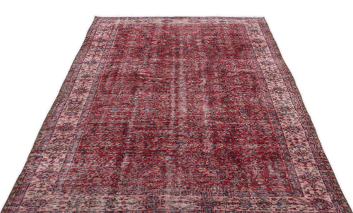 Load image 1 in gallery view. Distressed red and pink vintage-style rug with a traditional ornate border and faded central medallion pattern.