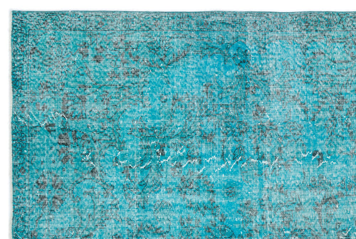 Load image 1 in gallery view. Teal and black distressed vintage-style rug with a faded floral medallion pattern on a white background.