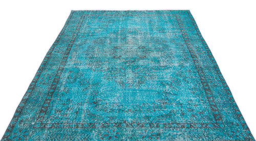 Load image 1 in gallery view. Bright turquoise distressed rug with a dark grey traditional medallion pattern and border on a white background.