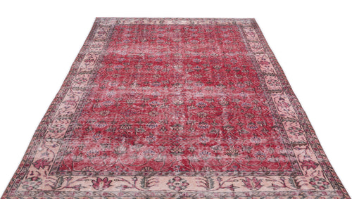 Load image 1 in gallery view. Distressed red and cream vintage-style rug with a traditional floral medallion pattern and a wide decorative border.