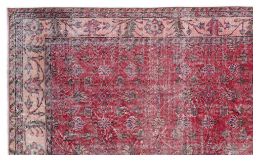 Load image 1 in gallery view. Distressed red rug with a floral medallion pattern and a wide, ornate beige border.