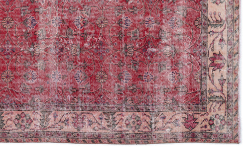 Load image 1 in gallery view. Distressed red and cream traditional rug with a faded floral medallion pattern and a decorative border.