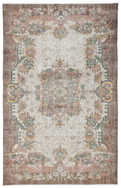 Load image 1 in gallery view. Distressed brown, cream, and sage green traditional rug with a central floral medallion and ornate border.