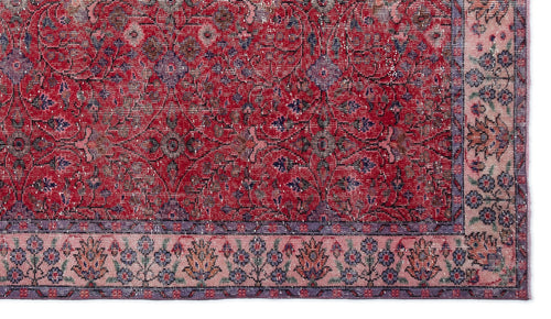 Load image 1 in gallery view. Red and purple traditional rug with a distressed floral pattern and a light pink botanical border.